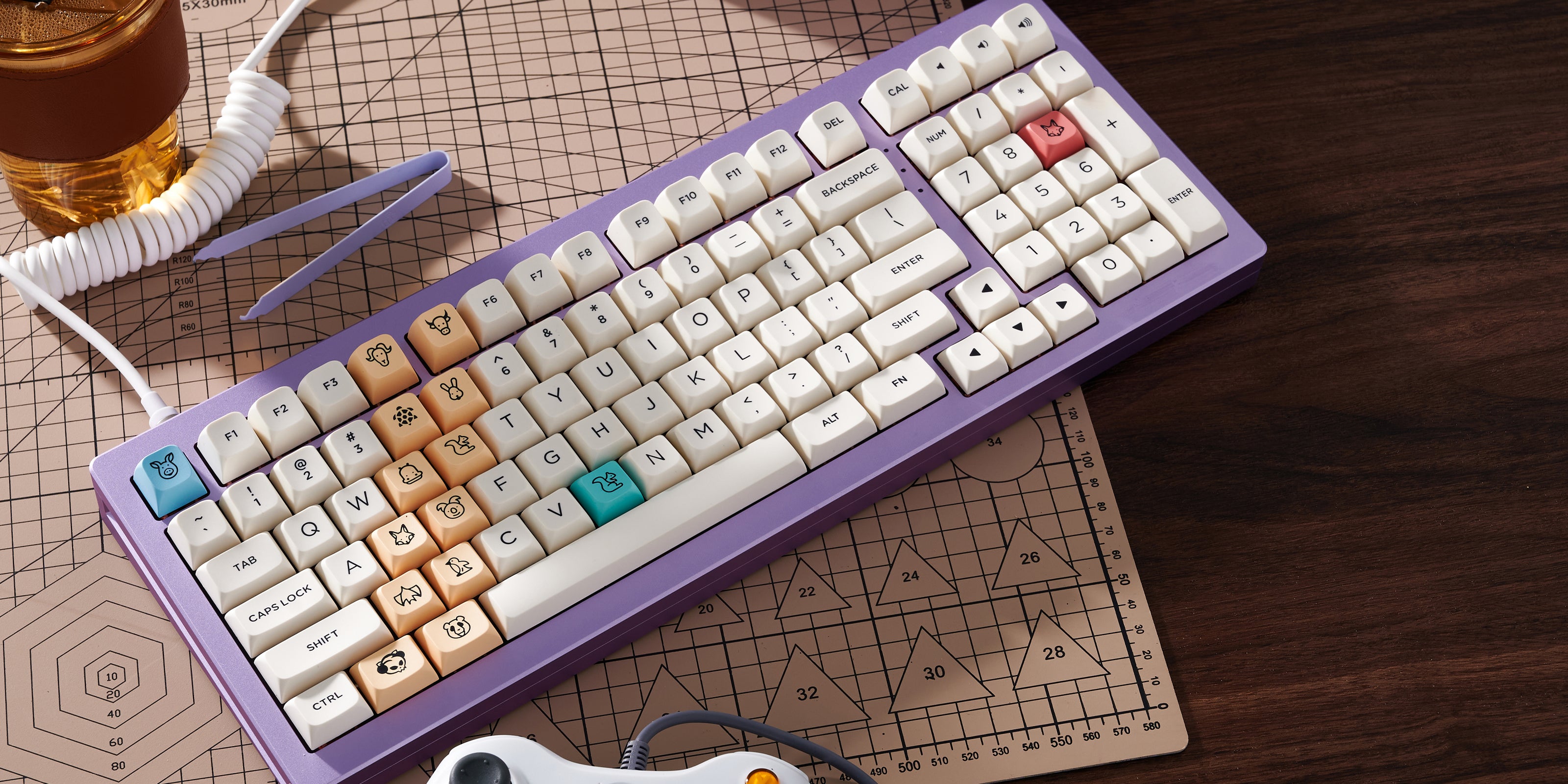 A vibrant purple MonsGeek M2 QMK 
keyboard with a frosty glass of beer resting on top